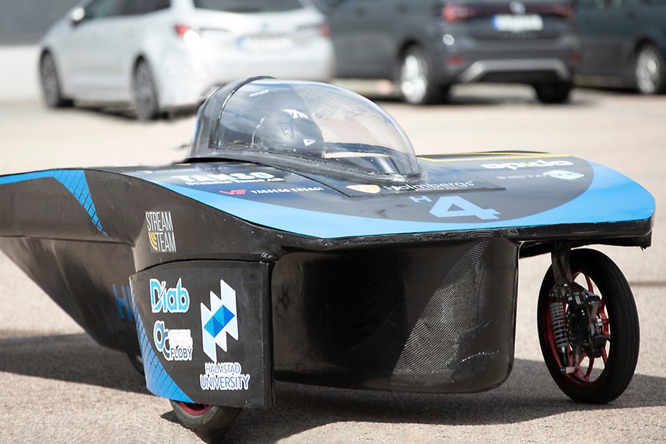 A black and blue racing car. Photo.