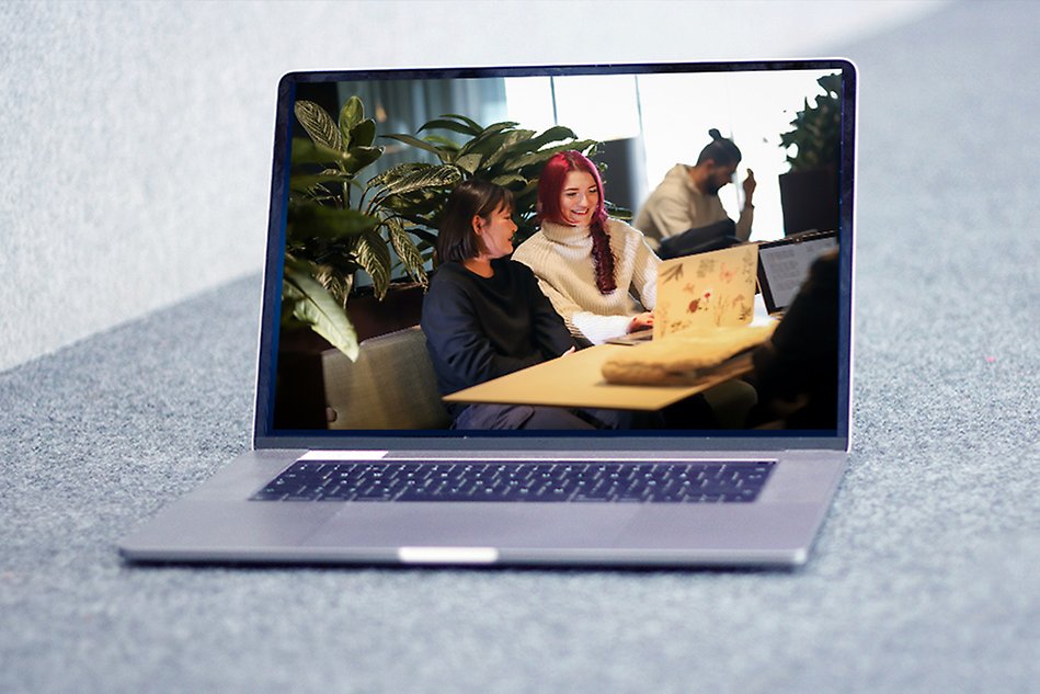 A photo of laptop showing a screen with students by a laptop. The photo is a montage. 