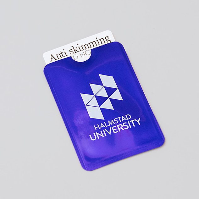 A bright blue plastic case with Halmstad University's English logo in white. Photo.