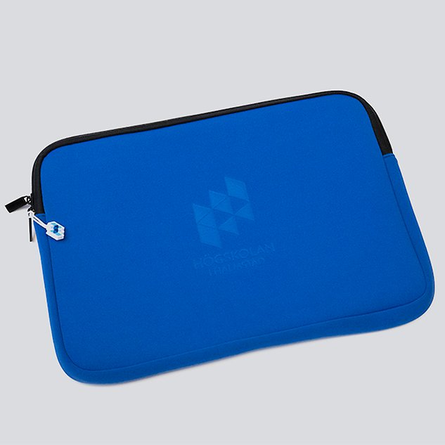 A bright blue laptop case, seen against a white background. Photo.