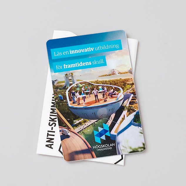 A card with an image of people on a flying, circular craft in a futuristic landscape. Photo.