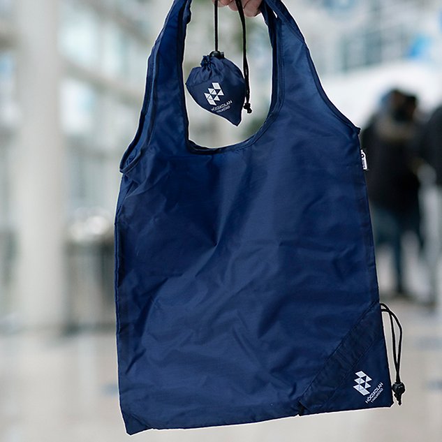 A blue bag in smooth material. Photo.